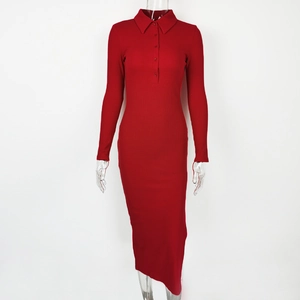 Detail of red ribbed long sleeve polo dress showing side slit and buttoned collar texture