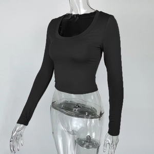Detail view of the black slim fit crop top with a deep U-neckline and long sleeves