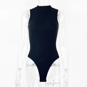 Detailed macro view of black ribbed knit fabric and stitching on a sleek bodysuit