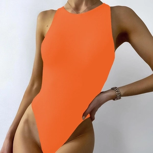 Detail of orange sleeveless bodysuit showing high-cut leg and seamless elastic fabric