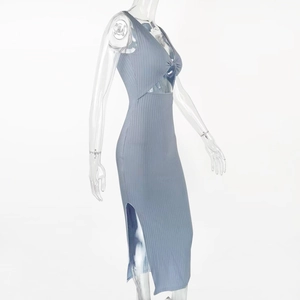 Detailed view of blue ribbed knit dress featuring a waist cutout and side slit detail