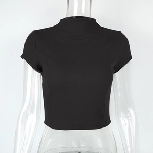 Close-up of black ribbed knit crop top featuring a mock neck and slim fit texture