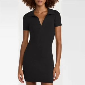 Detail of black ribbed knit fabric on a slim-fit polo collar dress with V-neckline