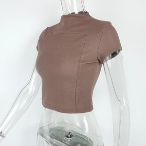 Detail view of brown ribbed mock neck crop top with vertical stitching and slim fit