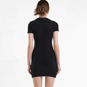Close-up of the ribbed knit fabric and slim-fit back tailoring of the black mini dress