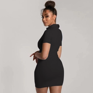 Detailed view of the ribbed V-neck polo collar and short sleeves on this black bodycon dress