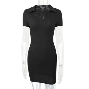 Detail of black ribbed knit texture on a slim-fit short sleeve polo mini dress