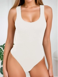 Detail showing high-cut silhouette and ribbed knit texture of off-white bodysuit