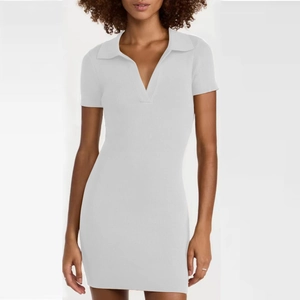 Close-up of white ribbed knit mini dress with stylish V-neck polo collar detail
