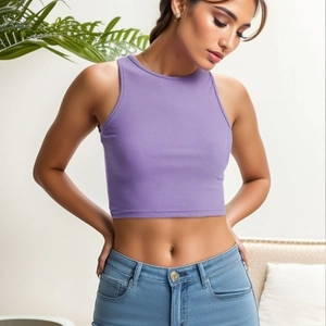 Detail view of light purple ribbed knit crop top and light blue denim pants on model