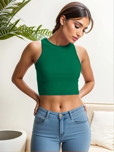 Detail shot of the green ribbed knit crop top featuring a slim fit and round neckline texture
