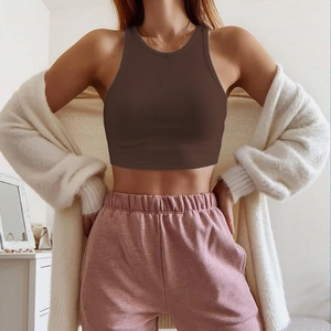 Brown ribbed knit crop tank top styled with a white cardigan for a summer outfit