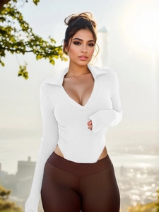 Detail of white ribbed long sleeve polo bodysuit with deep V-neck and slim fit texture