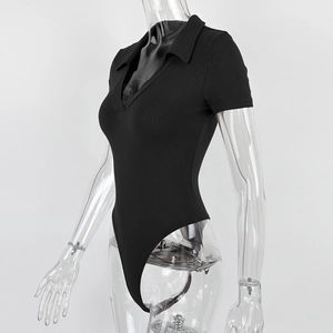 Detail of ribbed black short-sleeve bodysuit featuring a sleek Polo V-neckline design