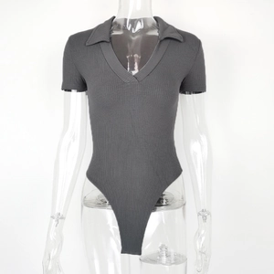 Detail of grey ribbed cotton bodysuit showing the polo collar and slim fit knit texture