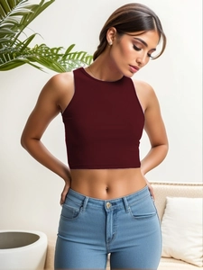 Slim fit burgundy ribbed knit crop top for women paired with light blue denim jeans