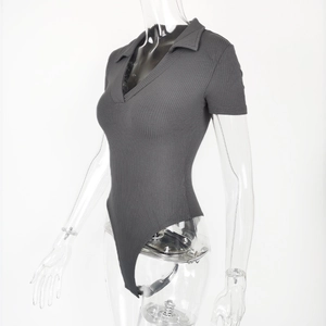 Detail of grey ribbed cotton bodysuit showing polo collar and slim fit texture