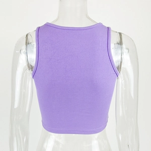 Detail view of purple ribbed knit crop top featuring a racerback design on a mannequin