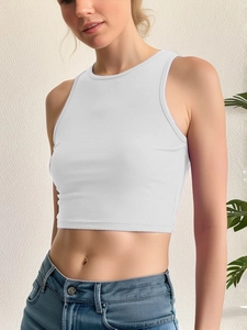 Detailed texture of white ribbed crop top with soft cotton fabric and crew neck design