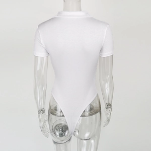 Macro detail of white ribbed cotton bodysuit showing the textured fabric and slim fit