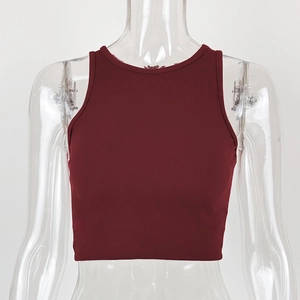 Detail of burgundy ribbed cotton crop top showing fine vertical knit texture and quality finish