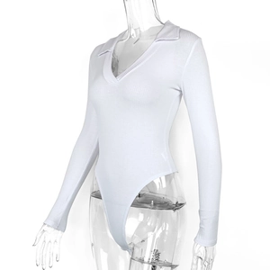 Detail view of the white rib-knit bodysuit featuring a deep V-neck and polo collar