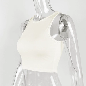 Detail of the ribbed cotton fabric texture on a slim fit white summer crop top
