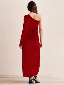 Back view of a red velvet one-shoulder dress with a side slit for parties