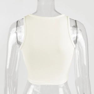 Detail showing the white ribbed cotton fabric texture and back cut of the slim crop top