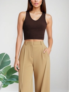 Close-up of ribbed texture on slim-fit V-neck tank top and high-waisted wide-leg pants