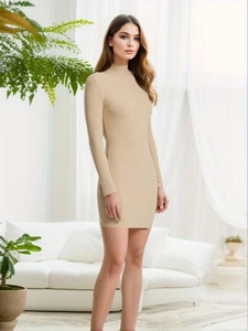 Detail of beige ribbed knit texture on a slim fit long sleeve mini dress