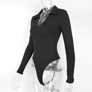 Detail view of the ribbed knit fabric and polo collar on this black long sleeve bodysuit