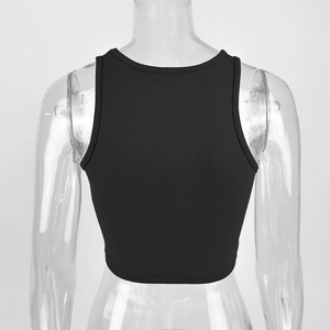Close-up of black ribbed crop top featuring a racerback design and elastic cotton fabric
