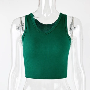 Close-up of dark green ribbed cotton crop top with V-neck and slim fit texture