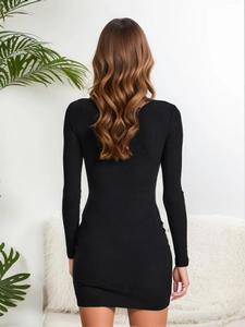 Slim fit black ribbed knit mini dress with long sleeves and mock neck back view
