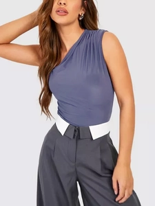 Detail view of the elegant shoulder pleats and slim fit tailoring on a lavender bodysuit