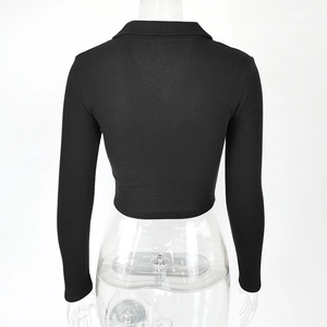 Detailed back view of a slim-fit black ribbed knit crop top with a classic polo collar