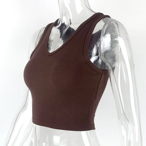 Detail of ribbed knit texture on a slim-fit V-neck dark brown crop top for women