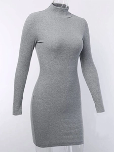 Close-up of the grey ribbed knit fabric and turtle neck detail on a slim fit dress