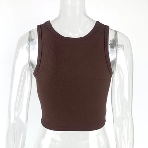 Detail shot of brown ribbed knit crop top with a close-up on fabric texture and stitching