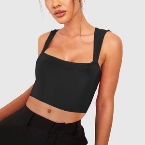 Detailed close-up of a black square neck cropped tank top made of stretch knit fabric