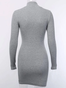 Detail of grey ribbed knit mini dress featuring a mock neck and slim fit bodycon texture