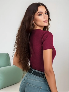Close-up of dark red ribbed knit fabric and slim-fit V-neck short sleeve bodysuit