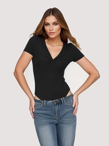 Close-up of the stylish twist front detail and V-neckline on the black ribbed bodysuit