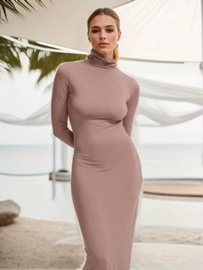 Detail of slim-fit dusty pink turtleneck long sleeve dress showing stretchy fabric texture