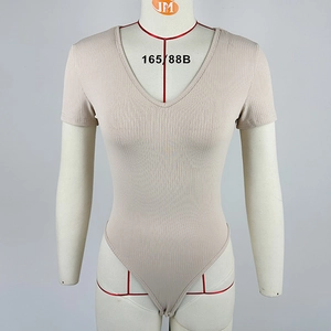 Detailed view of beige ribbed V-neck bodysuit showing short sleeves and slim fit texture