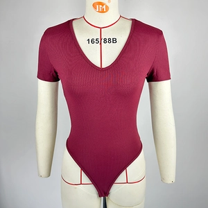 Detailed view of the ribbed texture and V-neckline on this slim fit burgundy bodysuit
