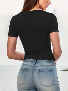 Slim fit black ribbed bodysuit with knot detail paired with light blue jeans, back view