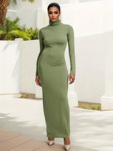 Elegant dark green turtleneck long sleeve bodycon maxi dress styled with silver heels