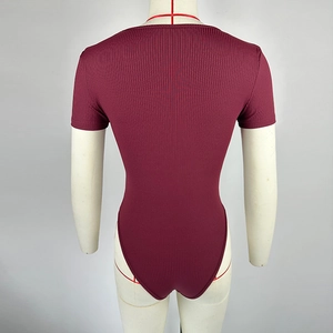 Rear view of a ribbed knit short sleeve bodysuit in deep burgundy on a mannequin